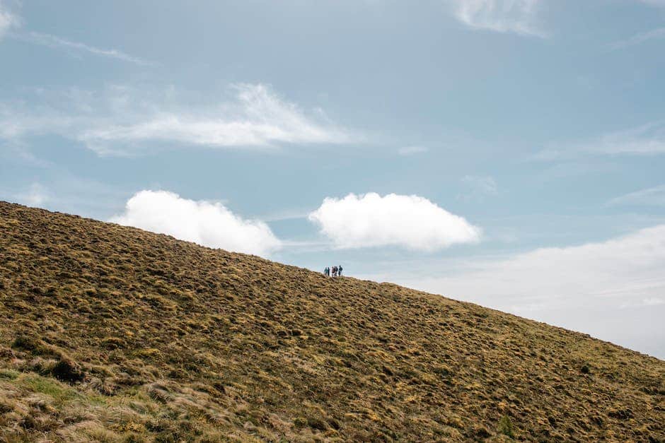 A group of people hiking in a picturesque mountain setting